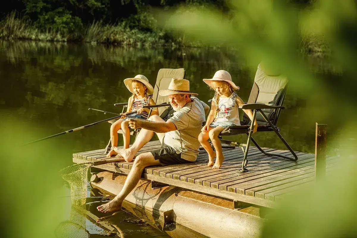 Grandpa and kids fishing lake auvergne